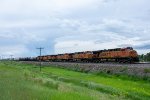 BNSF 5767 and 4 other units speed a westbound along the MRL 2nd Sub 